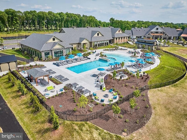 view of pool featuring a lawn and a patio