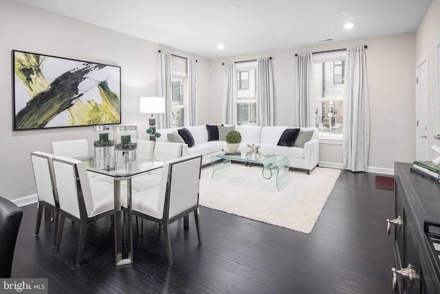 living room with dark hardwood / wood-style floors