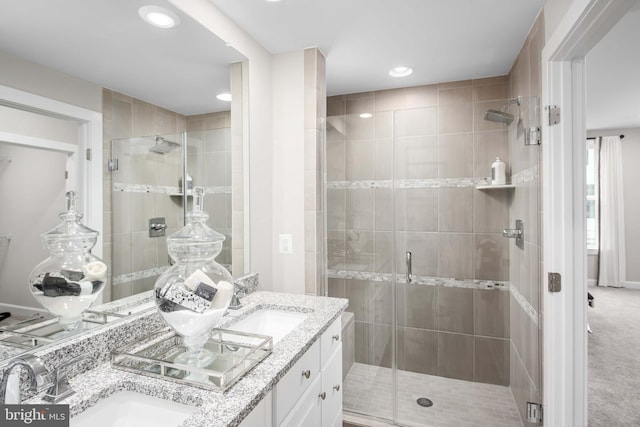 bathroom with vanity and an enclosed shower