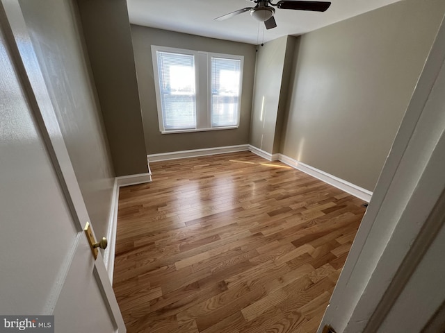 spare room with ceiling fan and light hardwood / wood-style flooring