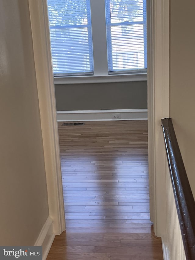 unfurnished room with hardwood / wood-style floors