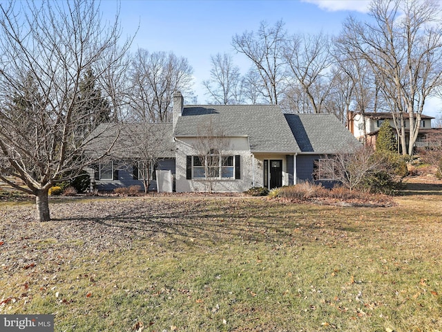 ranch-style home featuring a front lawn