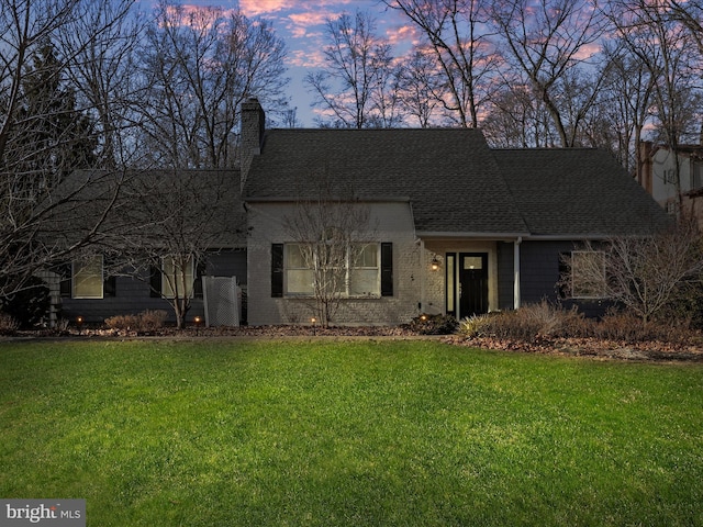 view of front of property with a yard