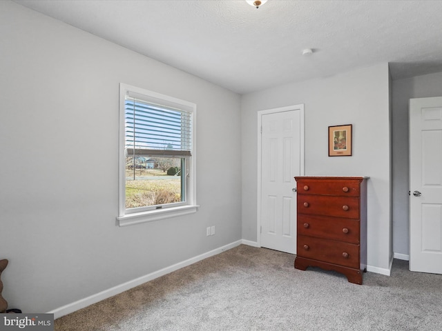 unfurnished bedroom featuring light colored carpet