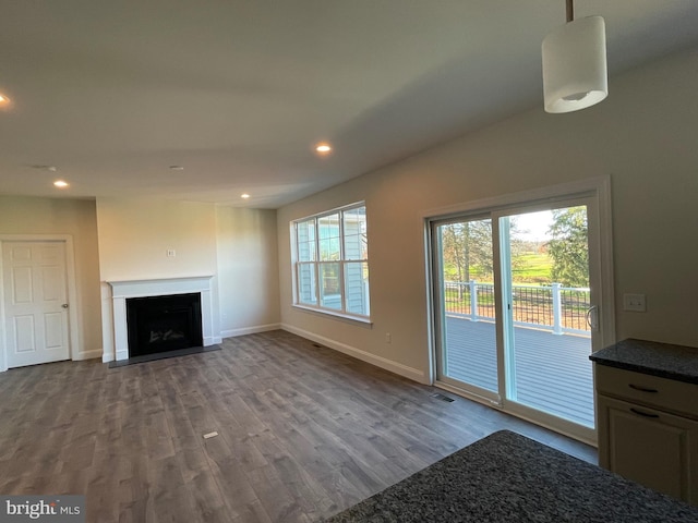 unfurnished living room featuring hardwood / wood-style floors