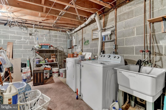 washroom featuring separate washer and dryer and sink