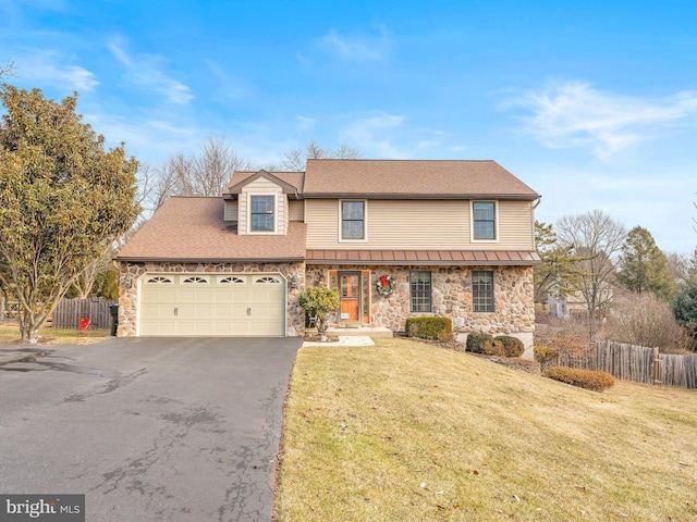 view of property featuring a garage and a front yard