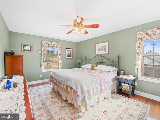 bedroom with ceiling fan and light hardwood / wood-style flooring