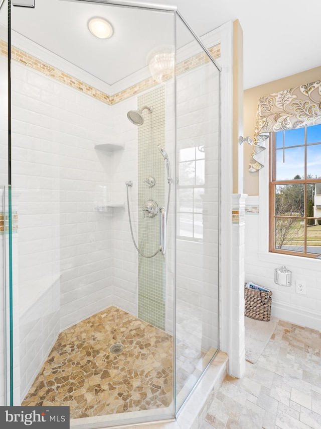 bathroom with tile walls and walk in shower