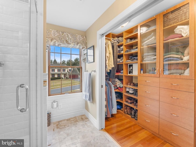 walk in closet featuring light wood-type flooring