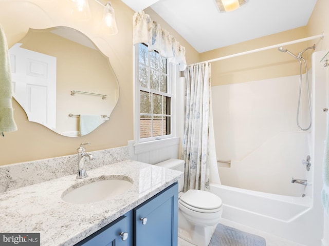 full bathroom featuring shower / tub combo with curtain, vanity, and toilet