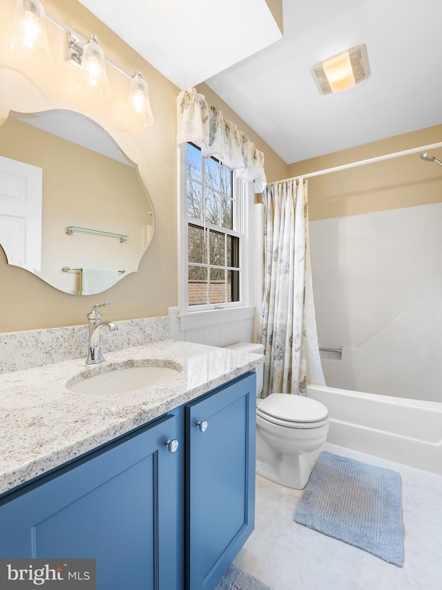 full bathroom featuring vanity, toilet, and shower / bath combo with shower curtain