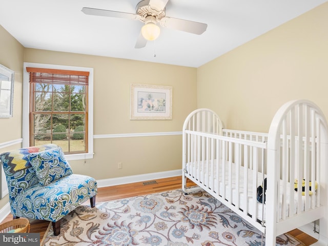 bedroom with hardwood / wood-style flooring and ceiling fan