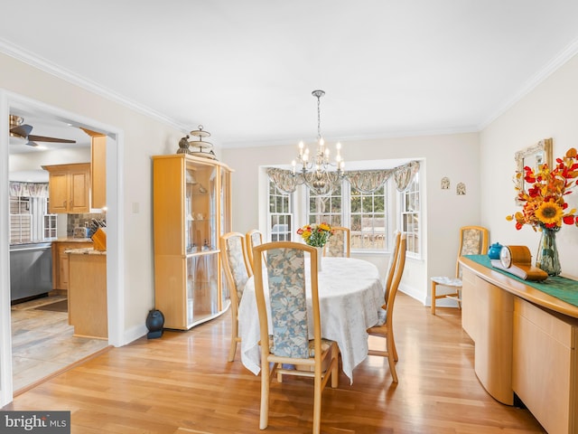 dining room with ornamental molding, ceiling fan with notable chandelier, and light hardwood / wood-style flooring