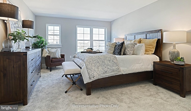 bedroom featuring light colored carpet