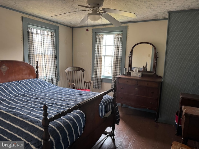 bedroom with hardwood / wood-style flooring and ceiling fan