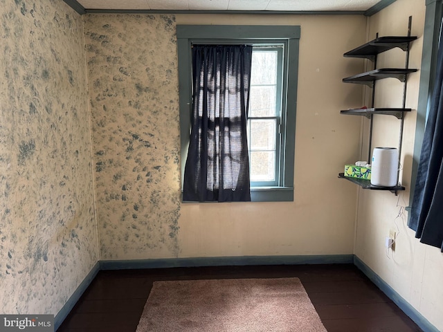 spare room featuring dark hardwood / wood-style flooring