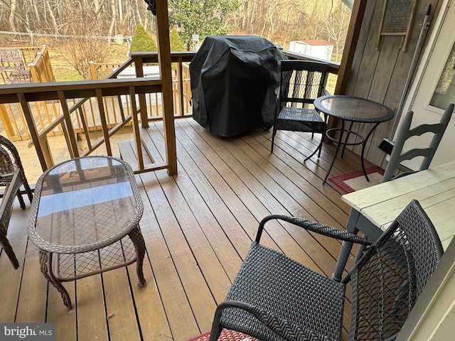 wooden deck with grilling area