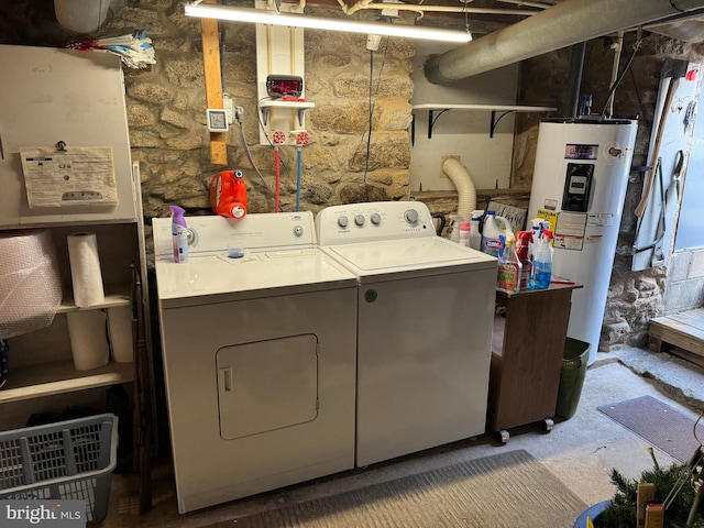 laundry area featuring electric water heater and independent washer and dryer