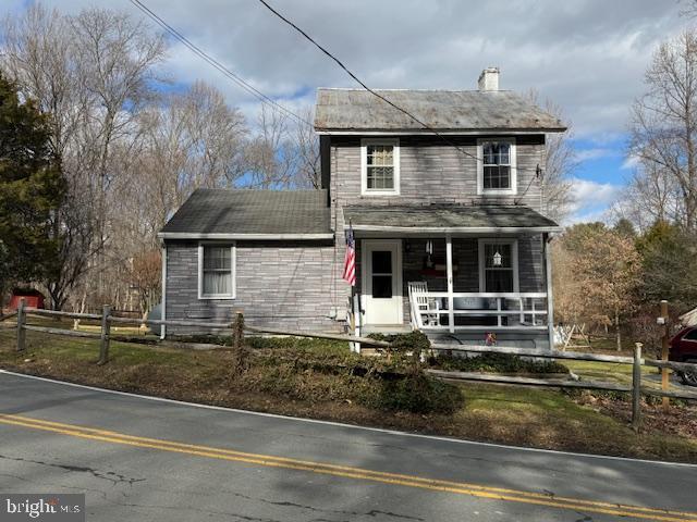 front facade featuring covered porch