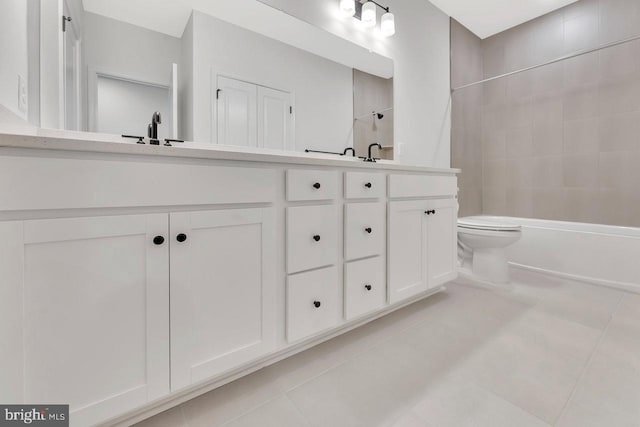 full bathroom featuring vanity, tiled shower / bath combo, tile patterned floors, and toilet