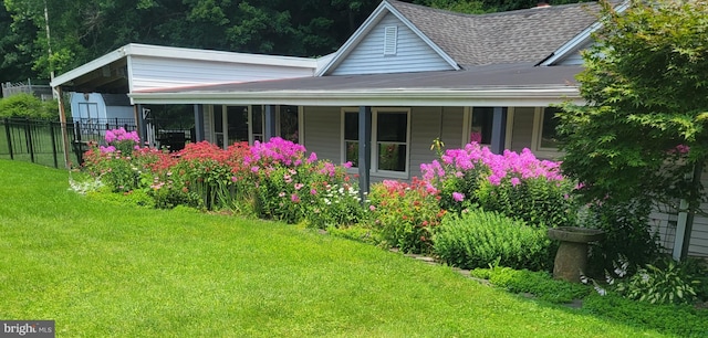 view of property exterior with a yard