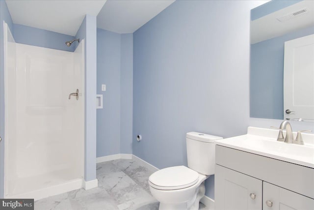 bathroom with vanity, toilet, and walk in shower