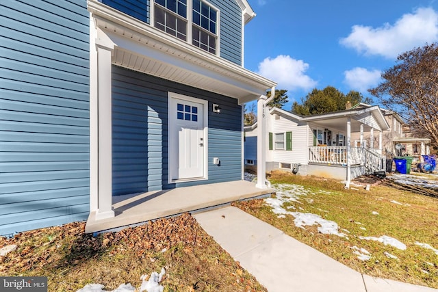 entrance to property with covered porch