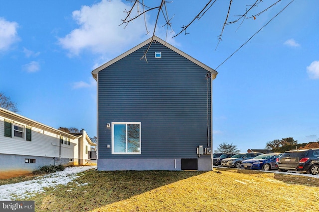 view of property exterior with a lawn