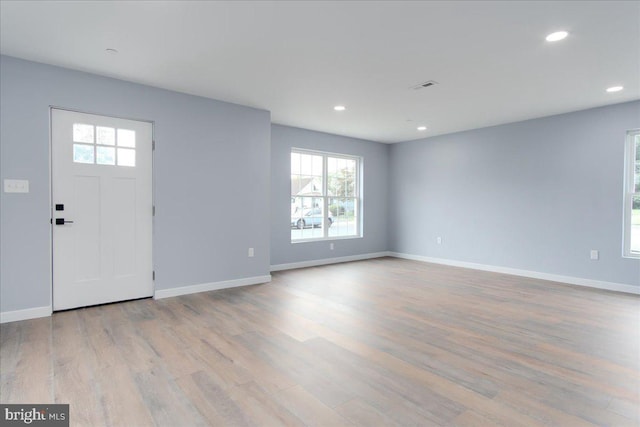 foyer entrance with light wood-type flooring