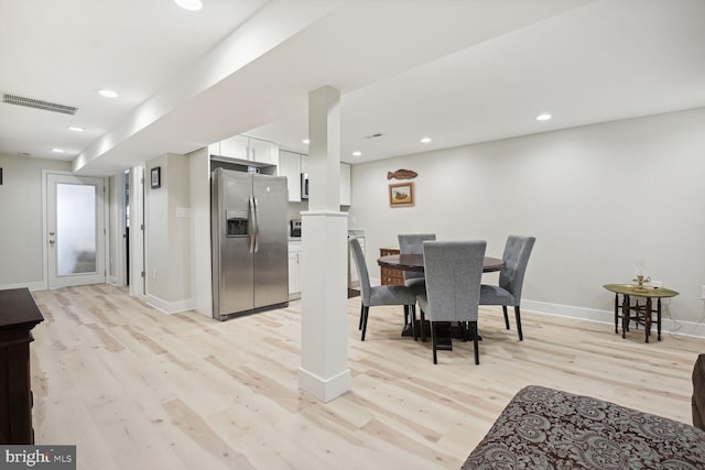 dining room featuring light hardwood / wood-style floors