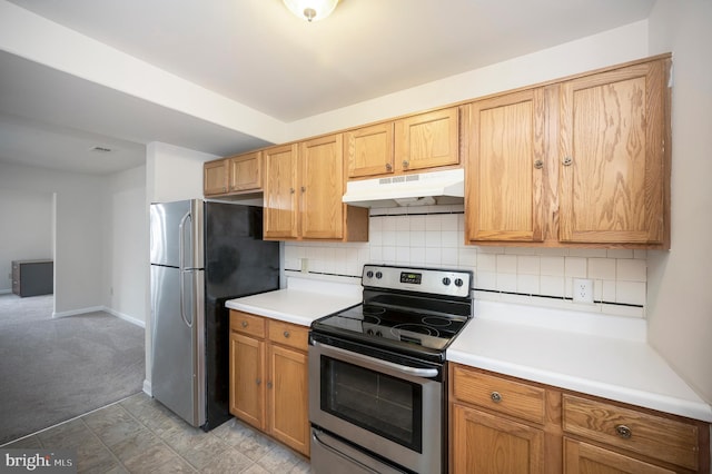 kitchen with light carpet, backsplash, and appliances with stainless steel finishes