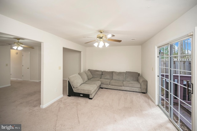 living room with light carpet and ceiling fan