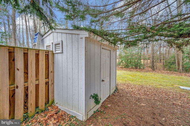 view of outbuilding with a lawn