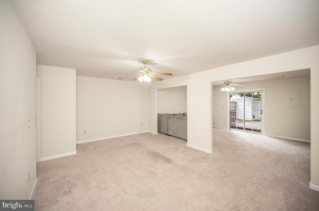 interior space with ceiling fan and light colored carpet