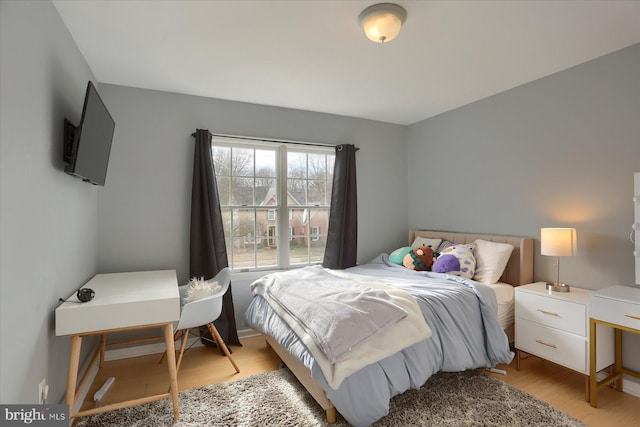 bedroom with light wood finished floors