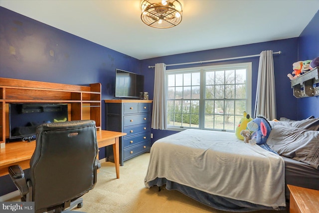 bedroom featuring light colored carpet