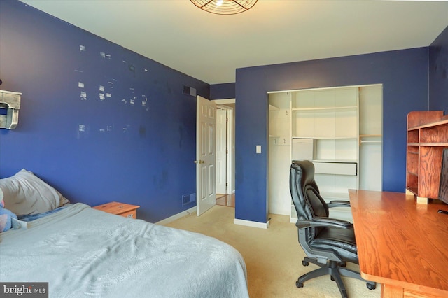 bedroom with light carpet, a closet, visible vents, and baseboards