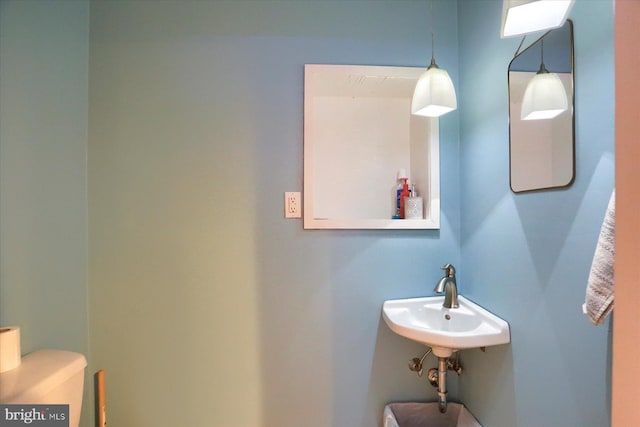 bathroom with a sink and toilet