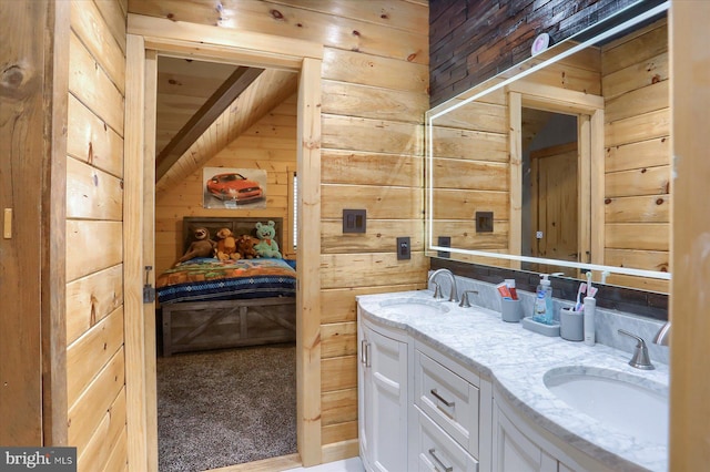 bathroom with double vanity, wooden walls, and a sink