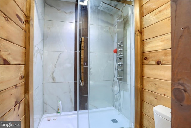 full bath with a shower stall and toilet