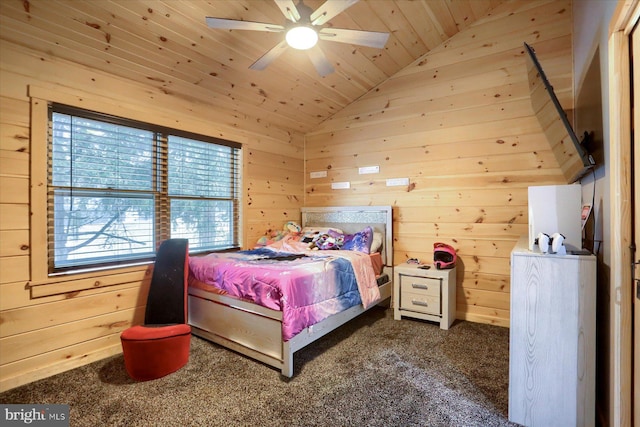 carpeted bedroom featuring wooden walls, wood ceiling, a ceiling fan, and vaulted ceiling