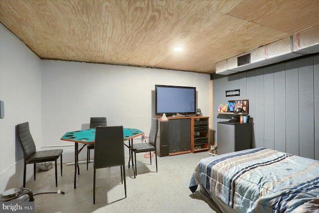 bedroom with wooden ceiling and speckled floor