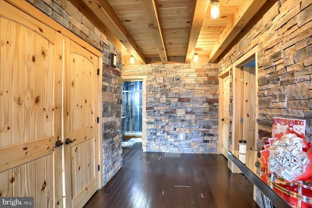 hall featuring beam ceiling, wooden ceiling, and hardwood / wood-style floors