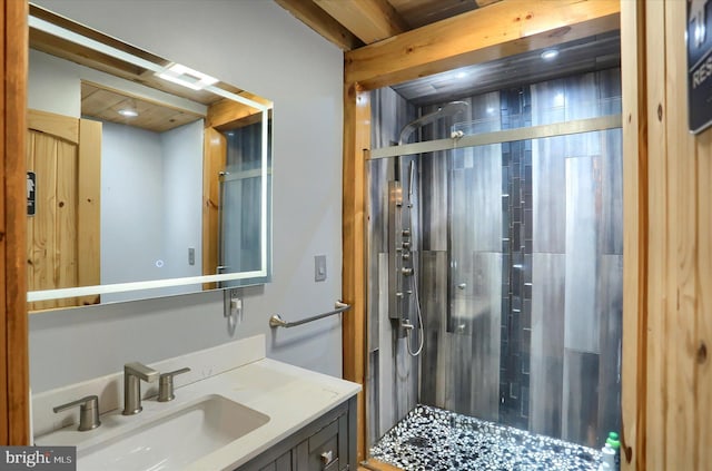 full bathroom featuring a shower stall and vanity