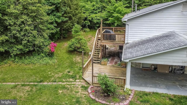 view of yard featuring stairway and a wooden deck