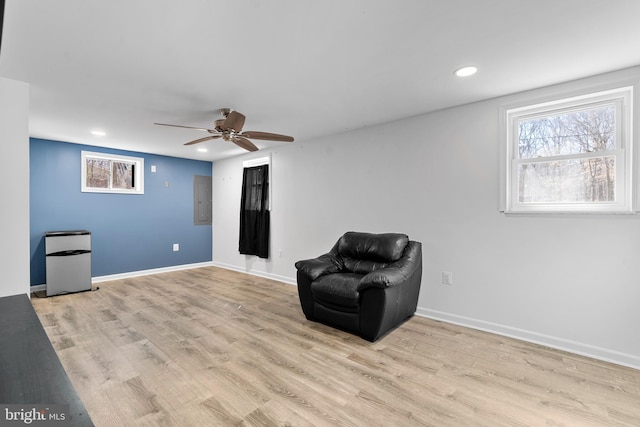 sitting room featuring baseboards, recessed lighting, a ceiling fan, and light wood-style floors