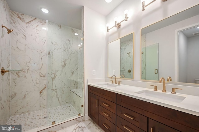 bathroom featuring vanity and a shower with door