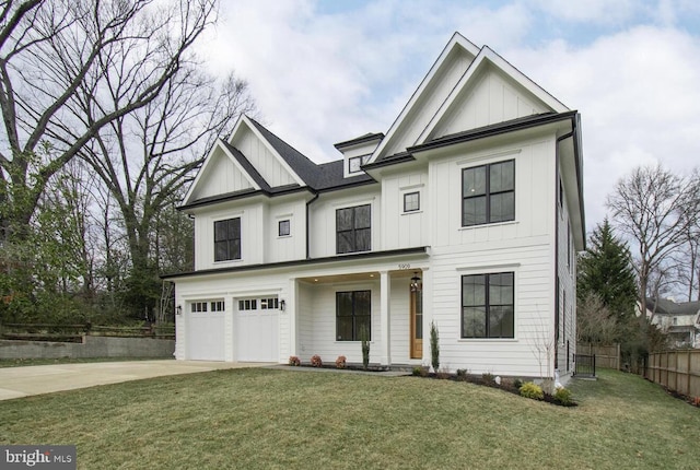 view of front of property with a garage and a front lawn