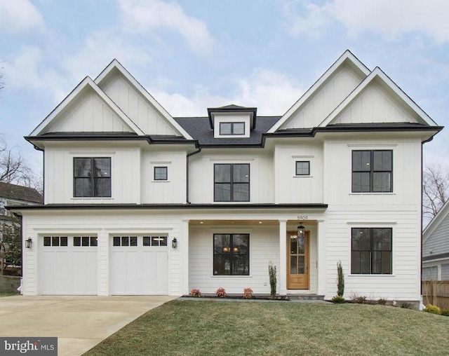 view of front of home featuring a garage and a front yard